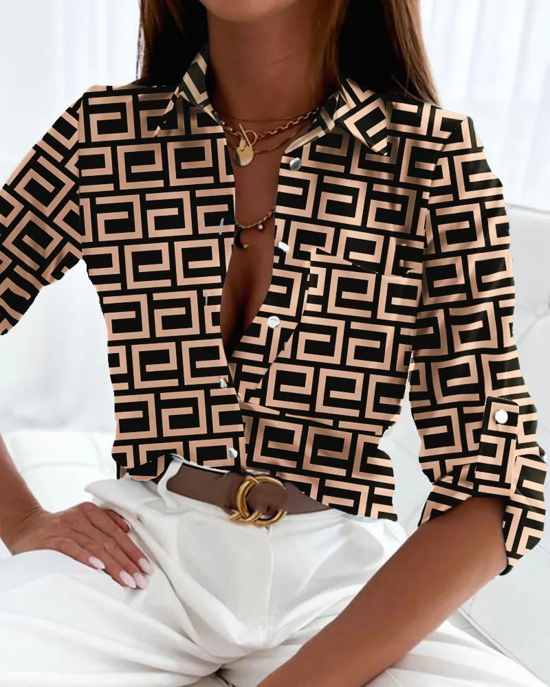 Chic women's collared V-neck blouse with a detailed graphic pattern & button-front closure. Comfortable long sleeve top.