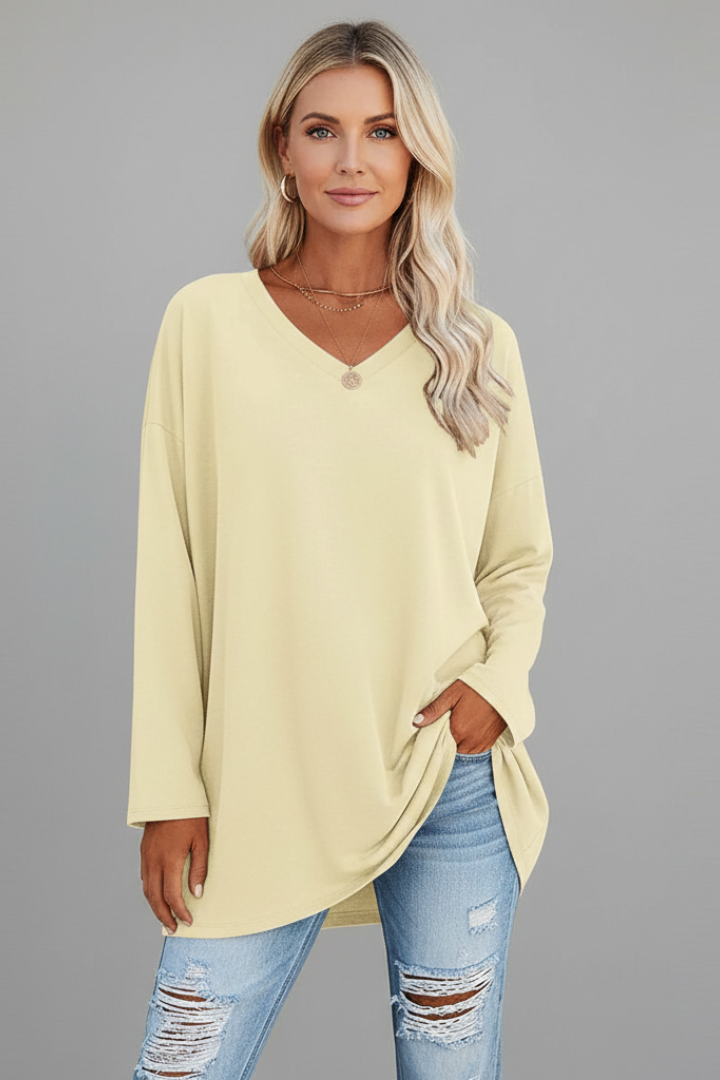 Chic women's V-neck long sleeve top, relaxed fit, combining comfort with modern everyday style.