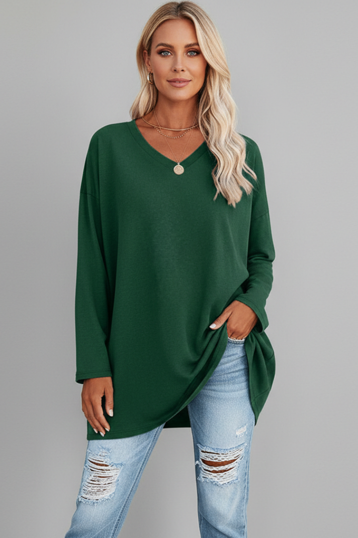 Relaxed fit women's V-neck top, long sleeve design, blending style and comfort seamlessly.