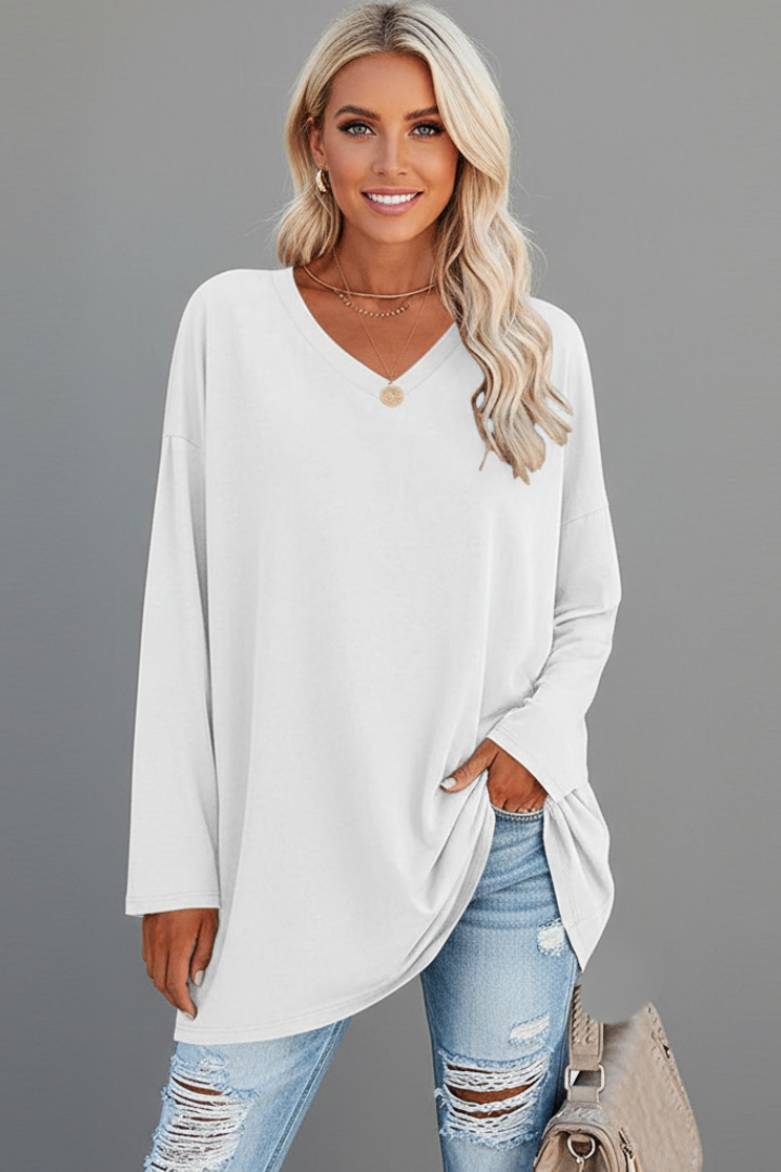 Fashionable women's long sleeve V-neck top, designed for a relaxed fit and ultimate comfort.