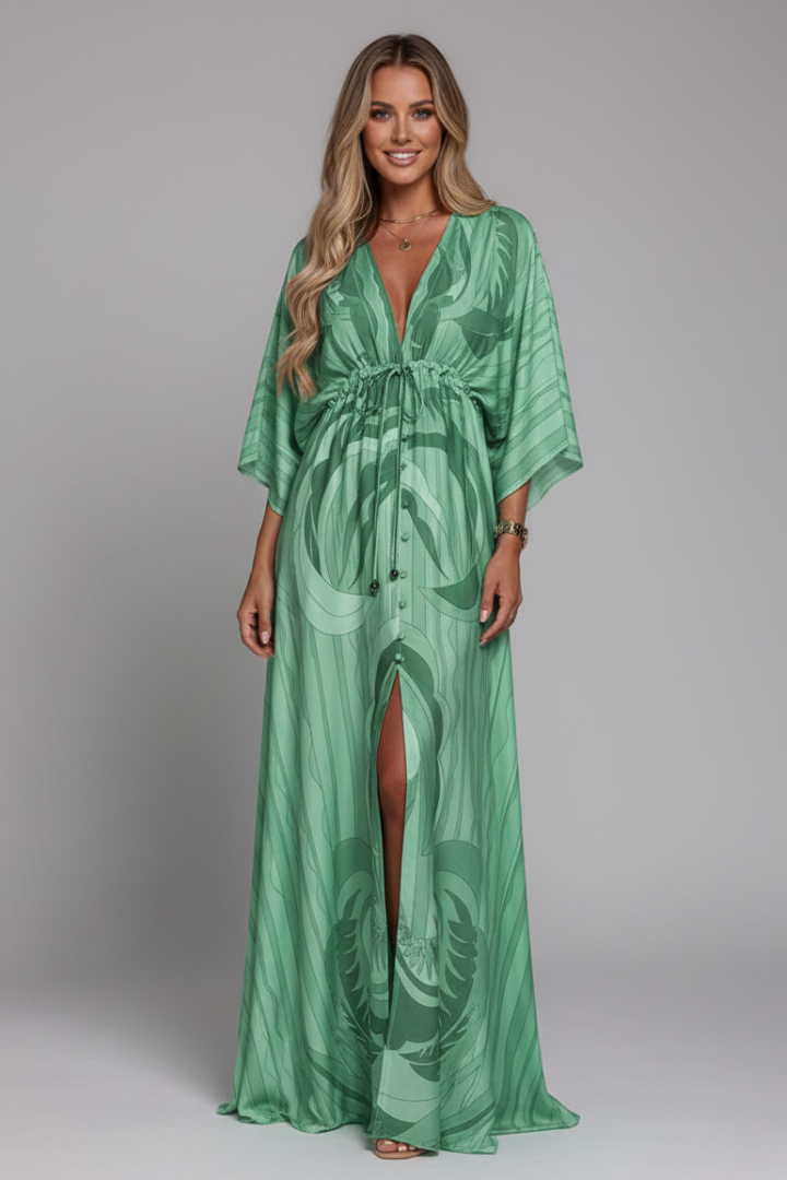 Flowy printed women's maxi dress, V-neck, tie waist. Perfect for elegant summer occasions.