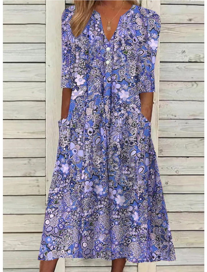 Flowy casual women's printed midi summer dress, featuring V-neck, 3/4 sleeves, and practical pockets.
