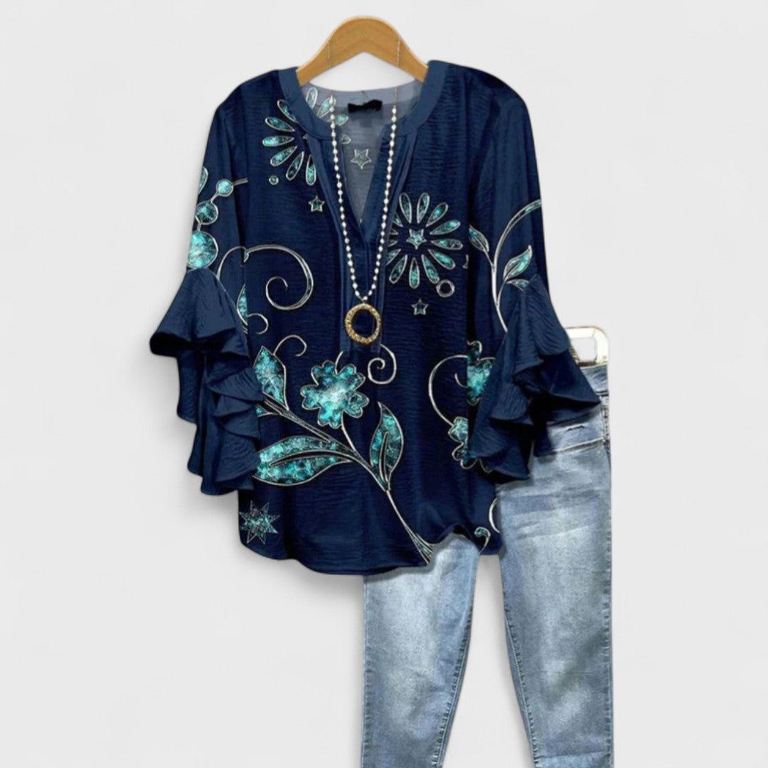 Comfortable ladies V-neck blouse with ruffle sleeves, great for everyday effortless style.