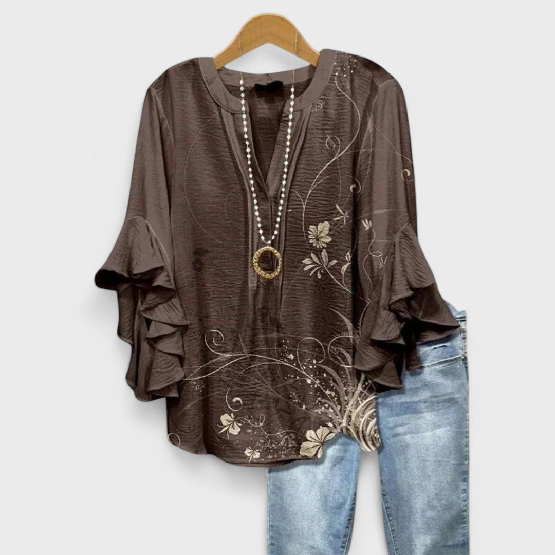 Elegant women's V-neck top with charming ruffle sleeves, ideal for spring fashion.