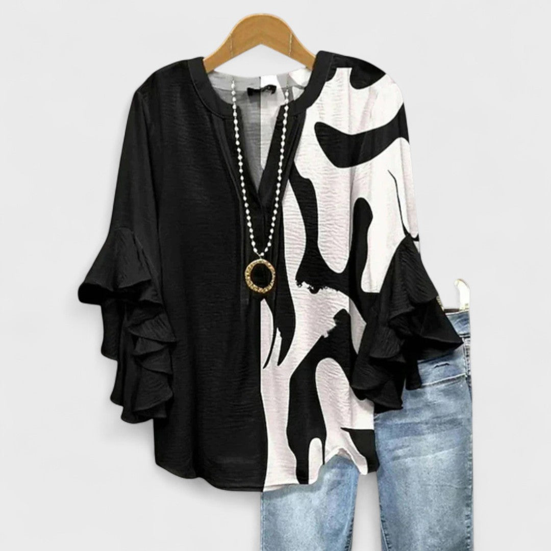 Stylish striped V-neck blouse for women with delicate ruffle sleeves. Casual & chic.