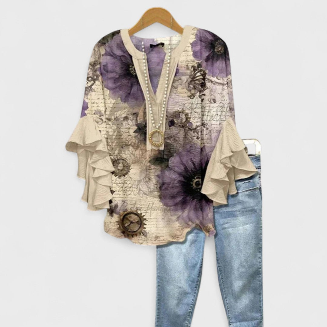 Fashionable printed V-neck blouse for ladies, featuring comfortable ruffle sleeves. Summer top.