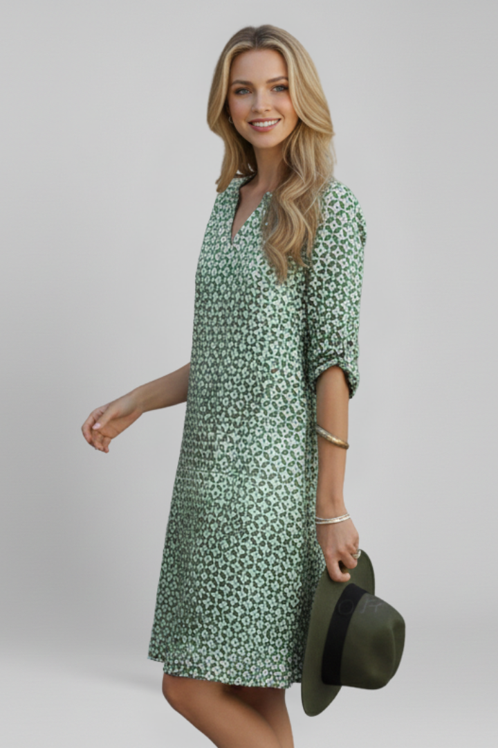 Versatile women's V-neck dress with ruffled sleeves, knee-length, ideal for day or evening wear.