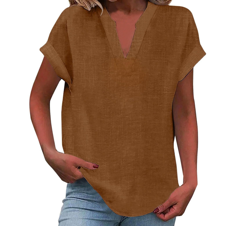 Flowy women's short sleeve blouse with a V-neck, providing effortless style and comfort for casual outfits.