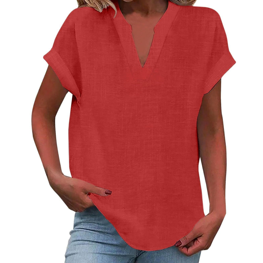 Woman wearing a comfortable V-neck short sleeve blouse, styled casually for a relaxed everyday look.