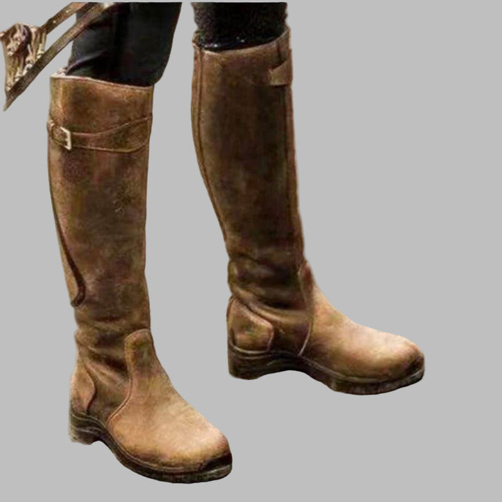 Close-up of Valdora women's knee-length buckled leather boots, showing texture and detail