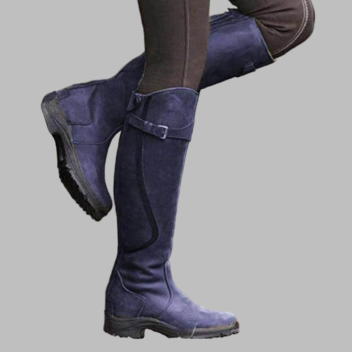 Pair of women's Valdora knee-length winter leather boots with buckled straps, front view