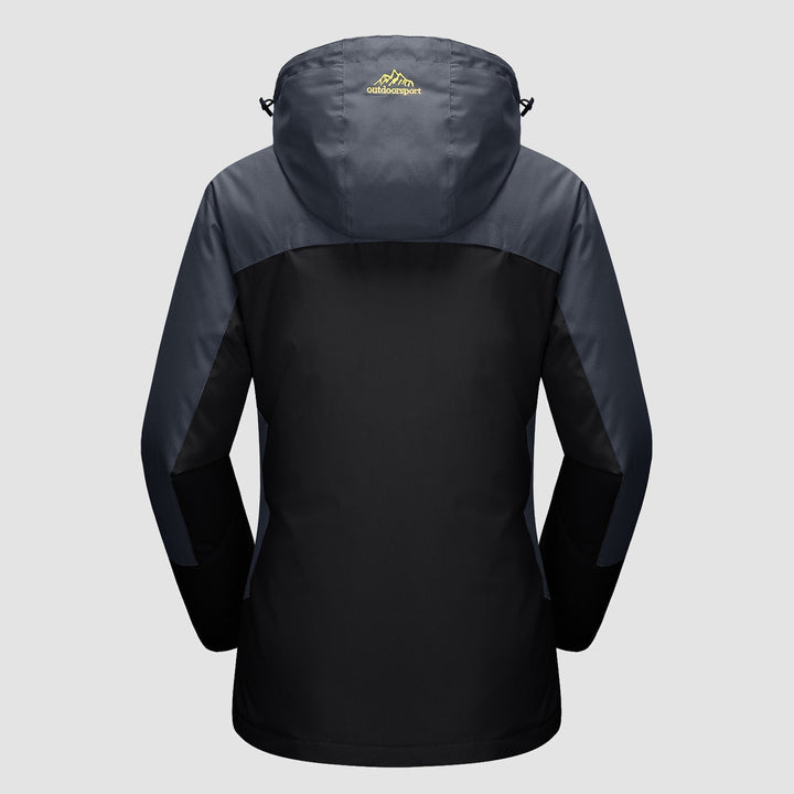 Woman enjoying a mountain view, wearing her Verona 3-in-1 waterproof jacket, ideal for active women.