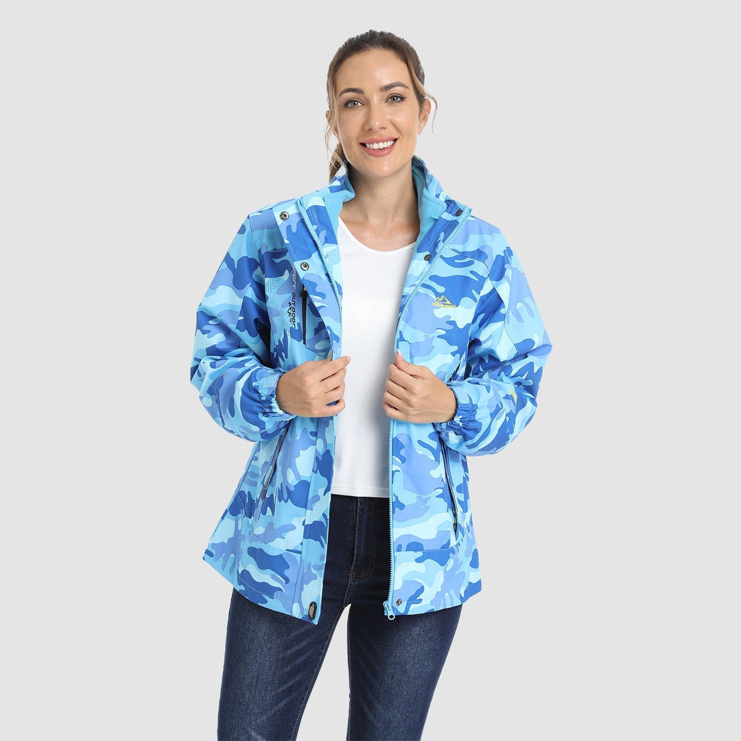 Woman adjusting her backpack, wearing a Verona 3-in-1 waterproof jacket, perfect for hiking.