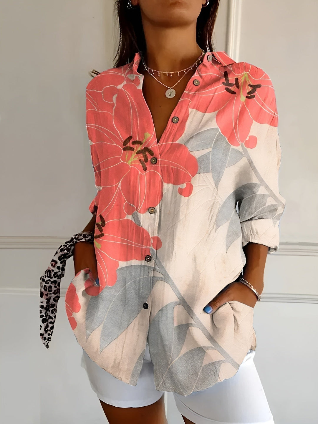 Everyday women's abstract print blouse featuring a split neck and long sleeves.