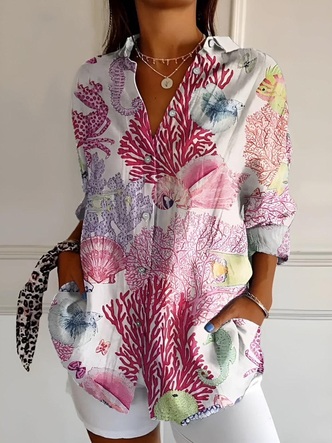 Versatile women's fashion top: abstract print, split neck, long sleeve, button front.
