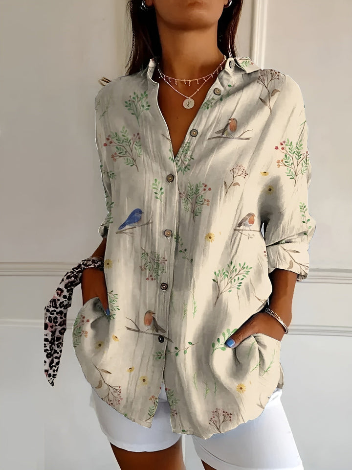 Flowy women's abstract print top, casual and stylish with split neck, long sleeves.