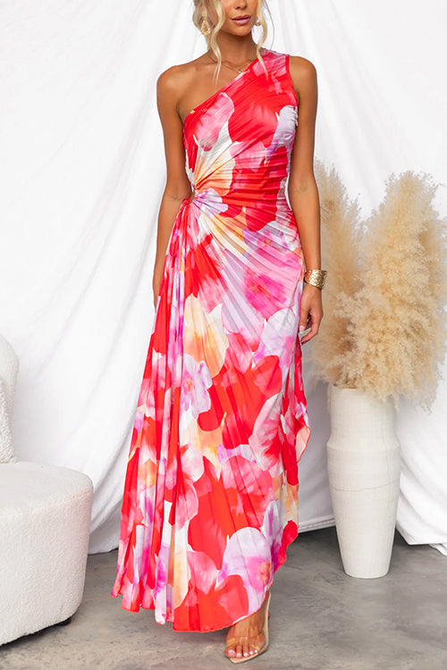 Stylish women's evening gown with a vibrant print, featuring an elegant one-shoulder asymmetric design.