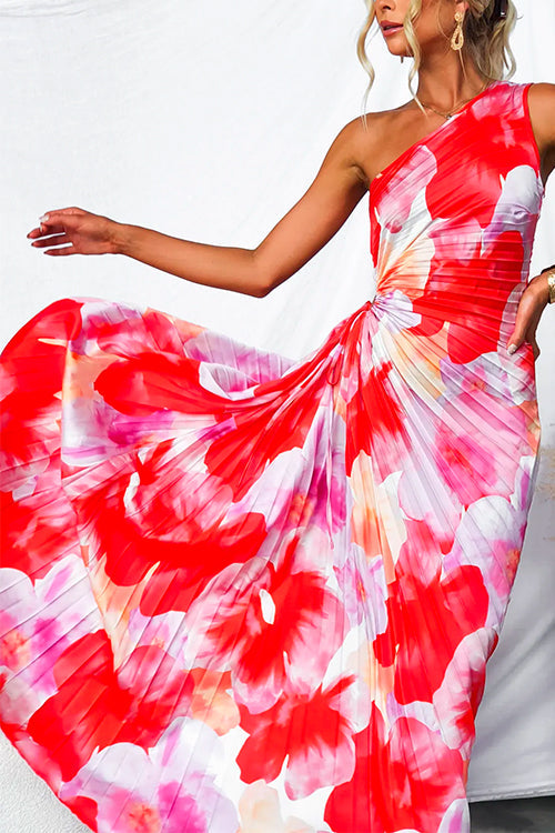 Fashionable women's cocktail dress: vibrant print, one-shoulder, and asymmetric flow. Ideal for events.
