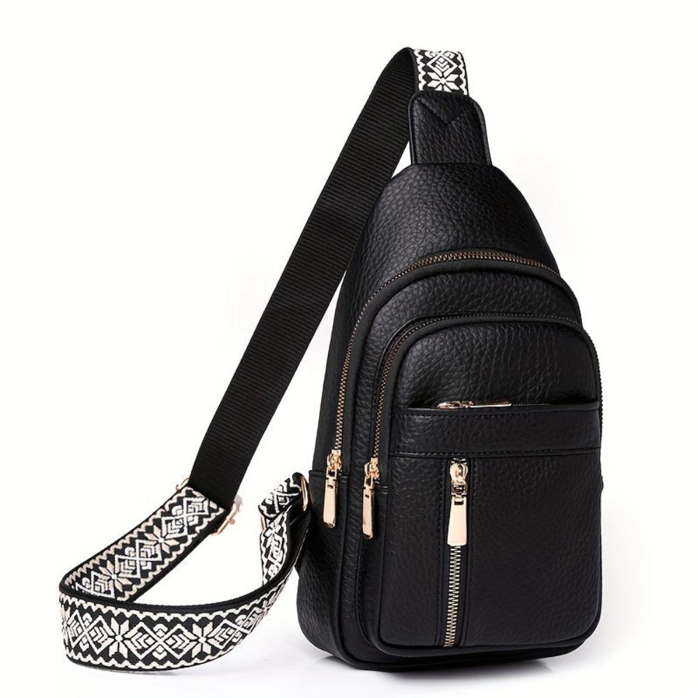 Women's vintage leather chest bag, highlighting buckle closure detail and craftsmanship.