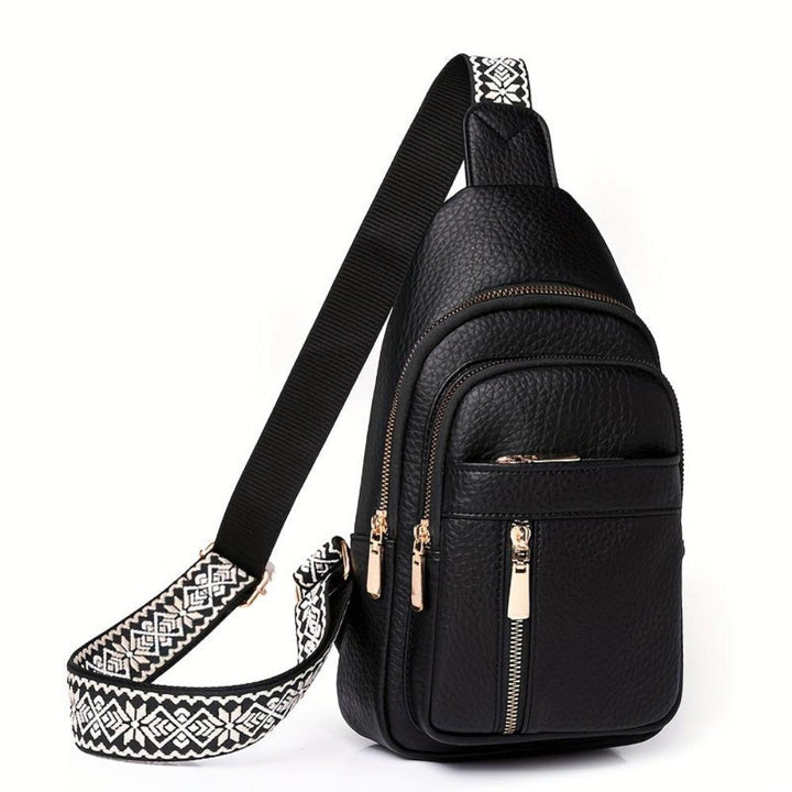 Women's vintage leather chest bag, highlighting buckle closure detail and craftsmanship.