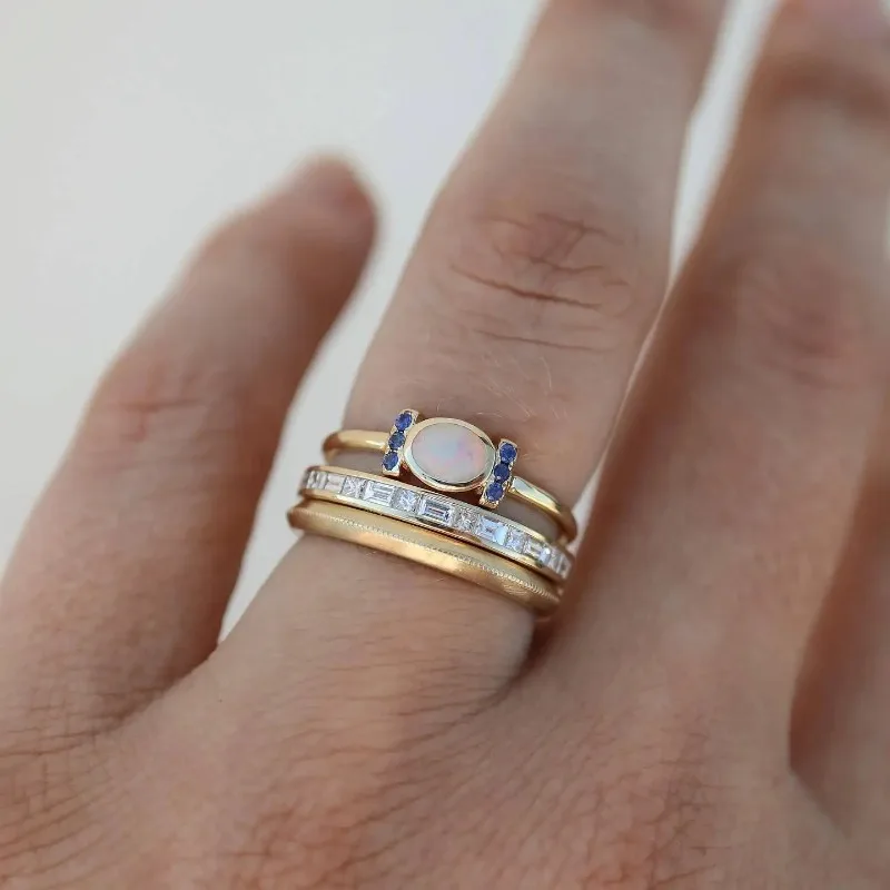 Women's vintage golden opal ring set. Stackable gold rings with stunning opal gemstones, perfect gift accessory.