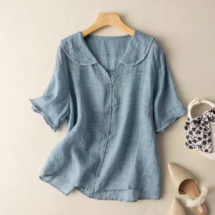 Elegant women's long-sleeve blouse in a vintage style, showcasing a beautiful scalloped collar and button-down design.
