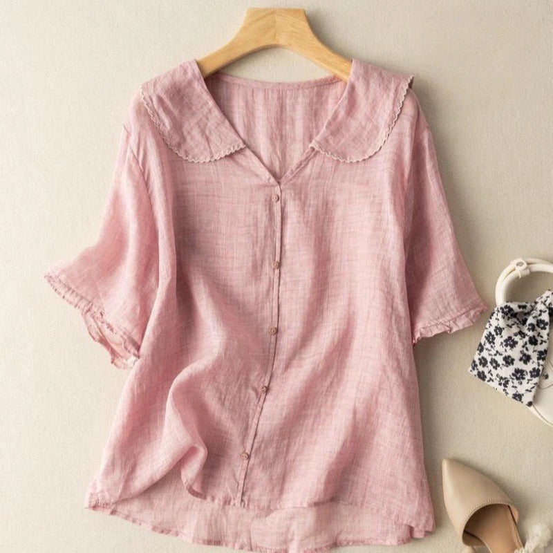 Versatile women's scalloped collar blouse. Chic long-sleeve button-down top offers effortless style for work or weekend.