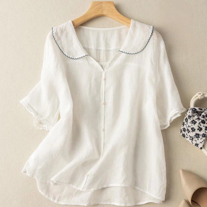 Fashionable women's blouse with a delicate scalloped collar, offering a comfortable fit and vintage charm for any outfit.