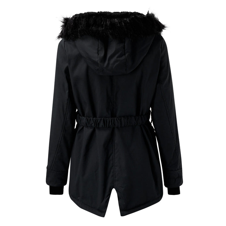 Close-up texture of the puffer material on a women's warm winter coat, durable and cozy.