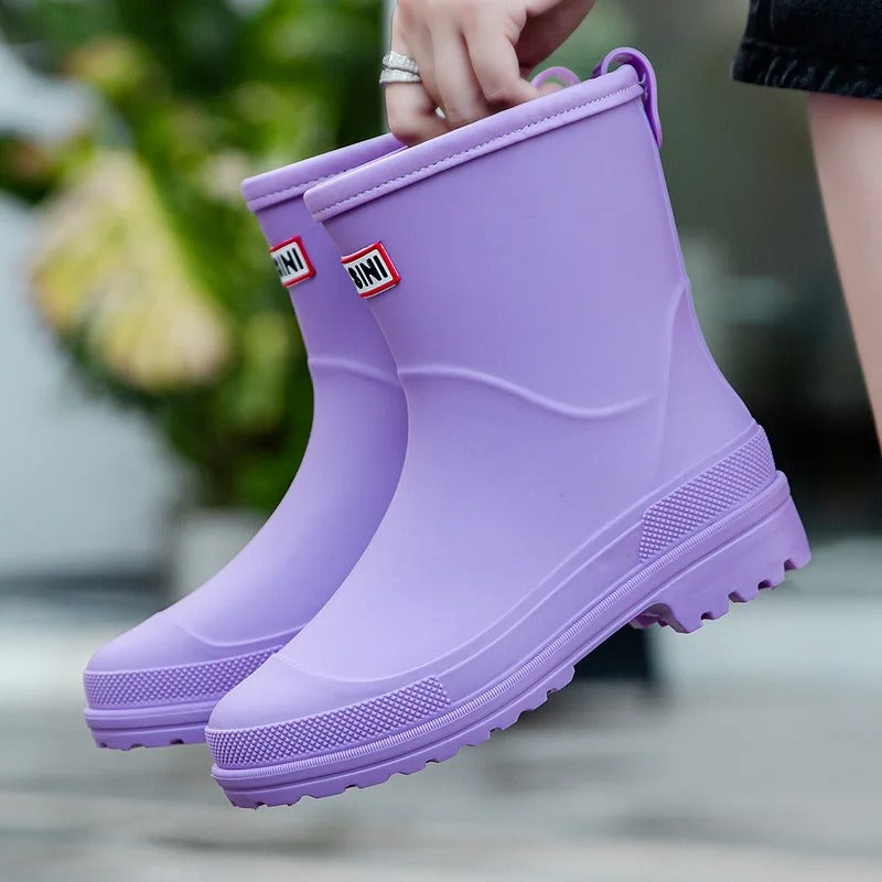 Comfortable women's slip-on rain boots. Waterproof ankle height for rainy day fashion.