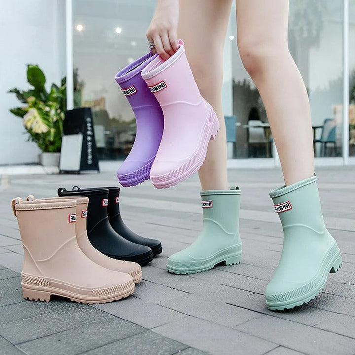 Modern women's slip-on rain boots. Waterproof ankle design, perfect for fashion & wet weather.