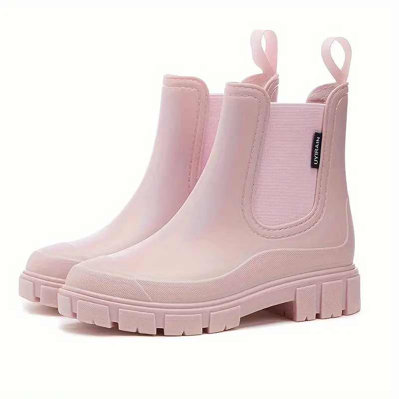 Pair of women's comfortable waterproof Chelsea boots, designed for easy slip-on and durable outdoor wear.