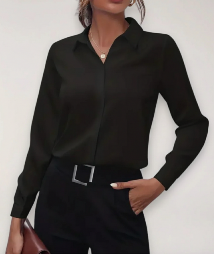 Professional women's work blouse, a classic buttoned top ideal for spring office wear.