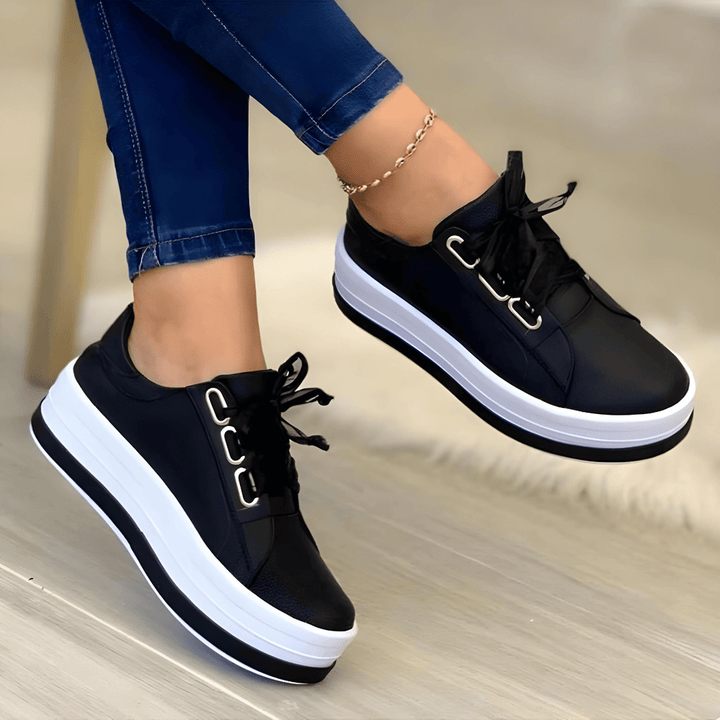 Women's white elevated sole platform sneakers, perfect for fashion-forward casual wear and comfort