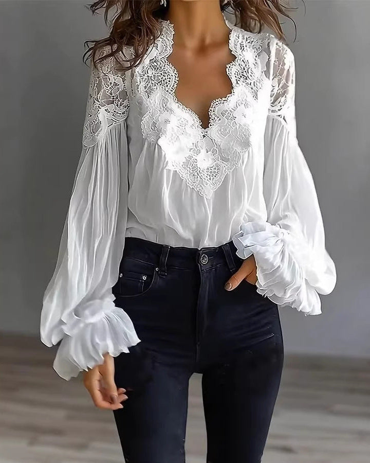 Women's white lace blouse with elegant V-neckline and stylish puffed ruffle sleeves for chic evening wear.