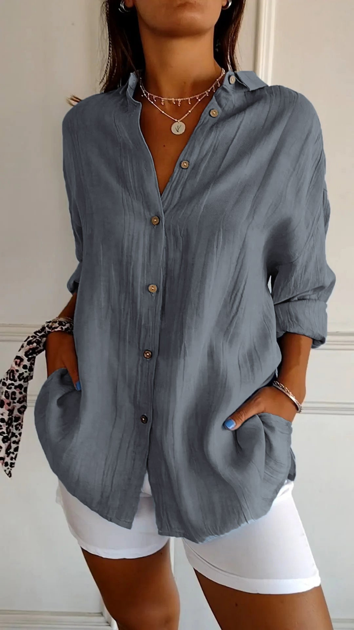 Effortless style women's oversized long sleeve button-down collared top. Relaxed fit for casual and everyday wear.