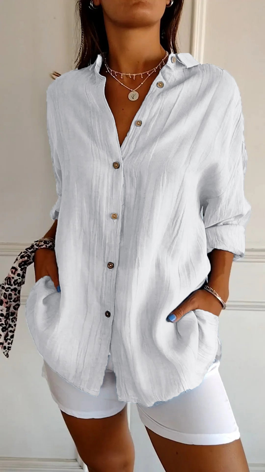 Comfortable women's oversized button-down collared shirt. Long sleeve, relaxed fit, great for everyday casual style.