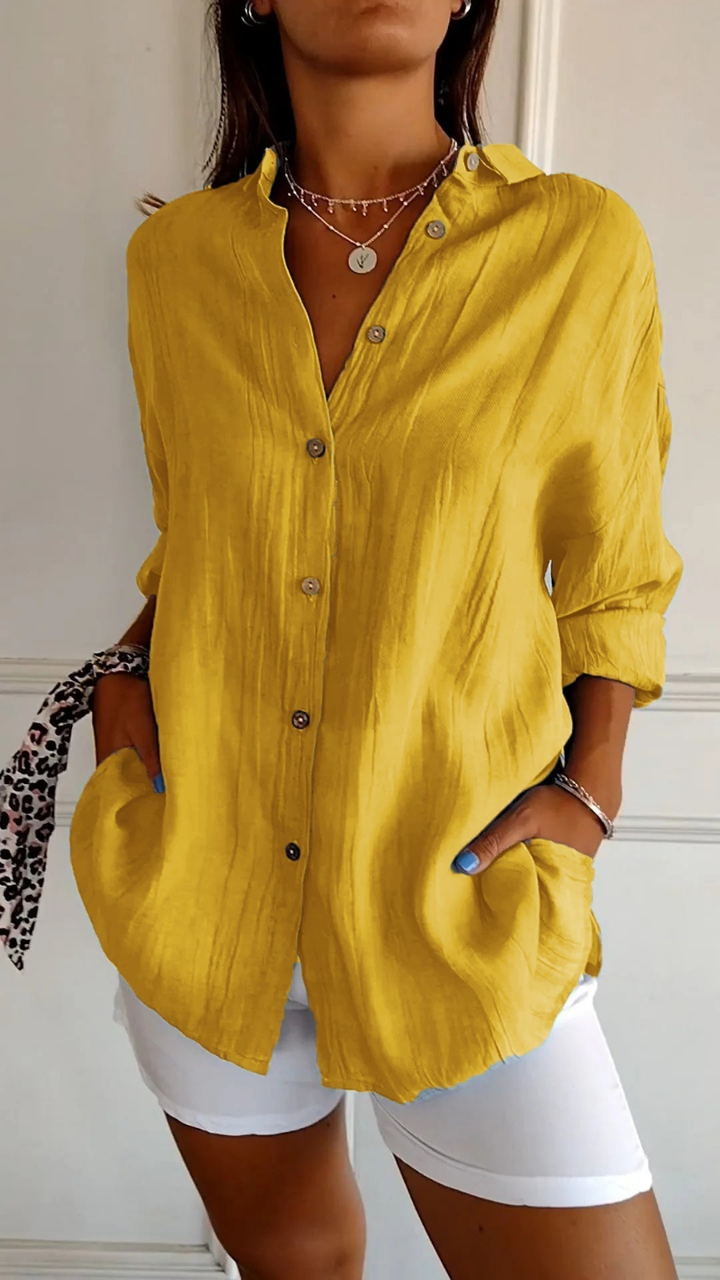 Women's relaxed fit button-down collared blouse. Oversized, long sleeve, ideal for casual wear & everyday style.