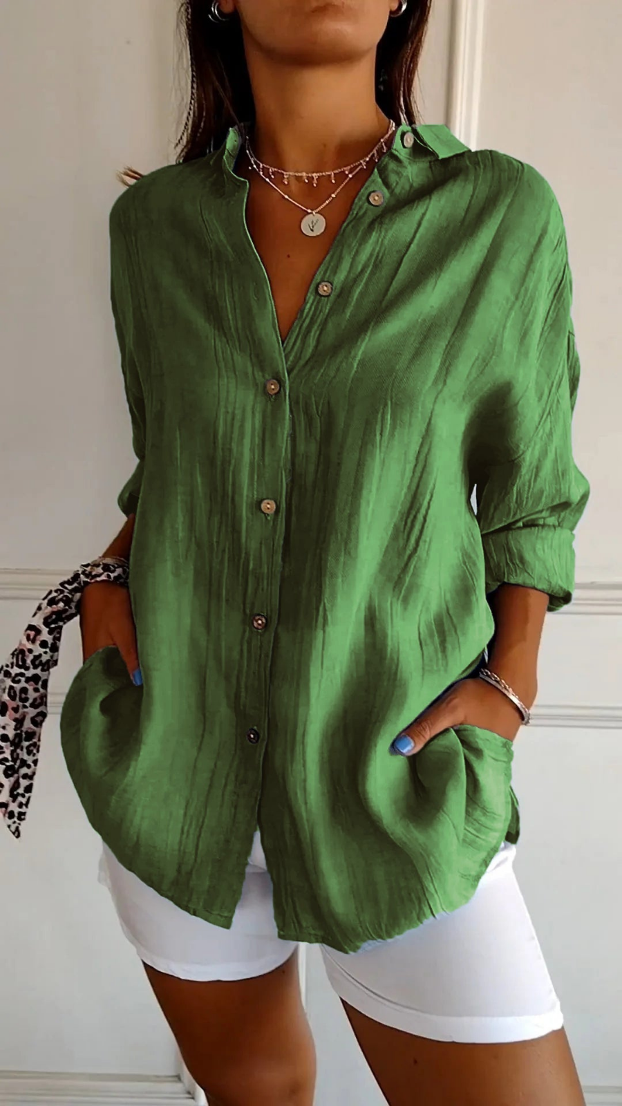 Lightweight women's oversized button-down collared blouse. Long sleeve, relaxed fit, essential for summer fashion.