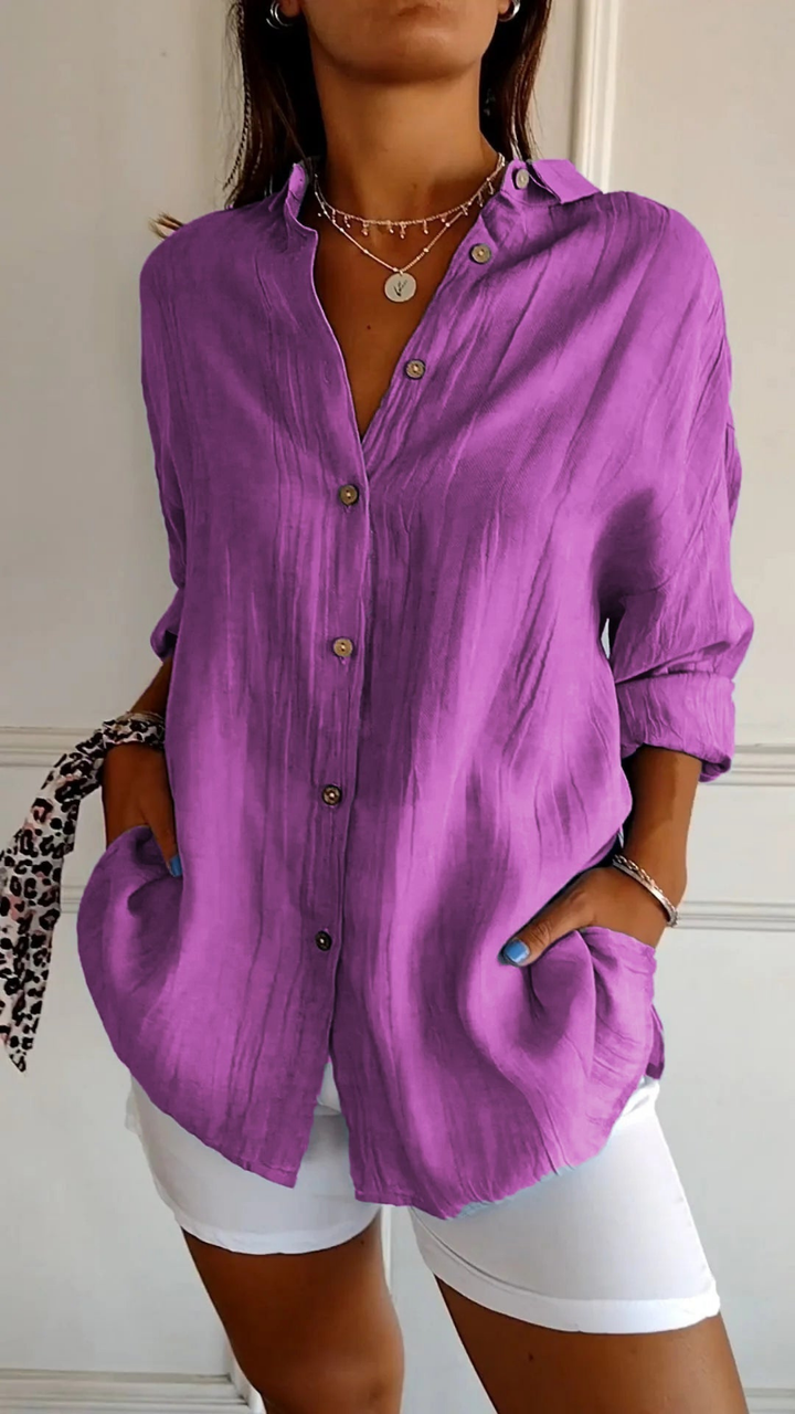 Women's casual oversized long sleeve button-down shirt. Collared top with a relaxed fit for versatile summer layering.