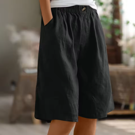 Front view: Women's wide leg Bermuda shorts with elastic waist and pockets, perfect for summer vacation.