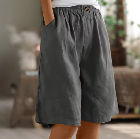 Comfortable wide leg Bermuda shorts for women with elastic waist, ideal summer beach or vacation wear.