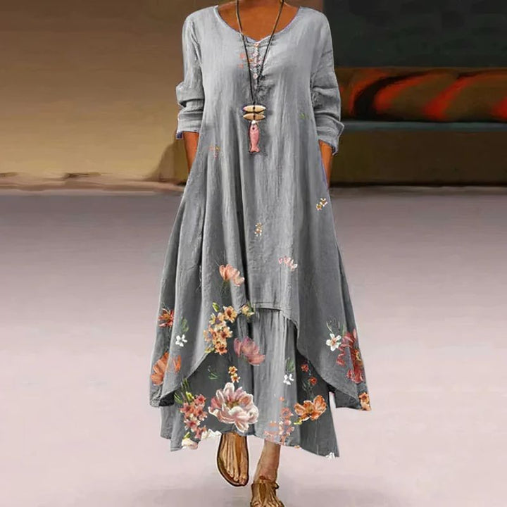 Women's boho maxi dress with long sleeves, layered hem, asymmetrical cut, and relaxed fit; ideal for spring outings.