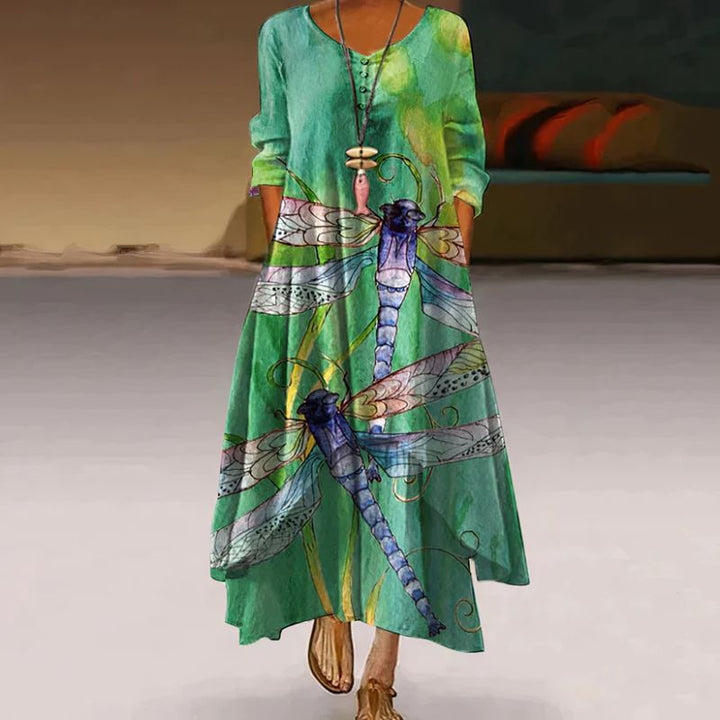 Women's boho maxi dress with long sleeves, layered hem, asymmetrical cut, and relaxed fit; ideal for spring outings.