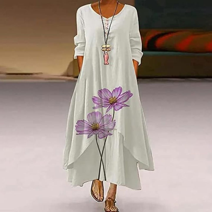 Women's boho maxi dress with long sleeves, layered hem, asymmetrical cut, and relaxed fit; ideal for spring outings.