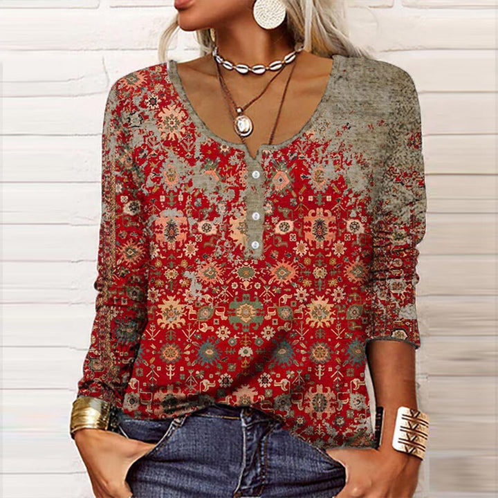 Women's buttoned long sleeve top with textured look, relaxed fit, and elegant appeal for casual or office wear.