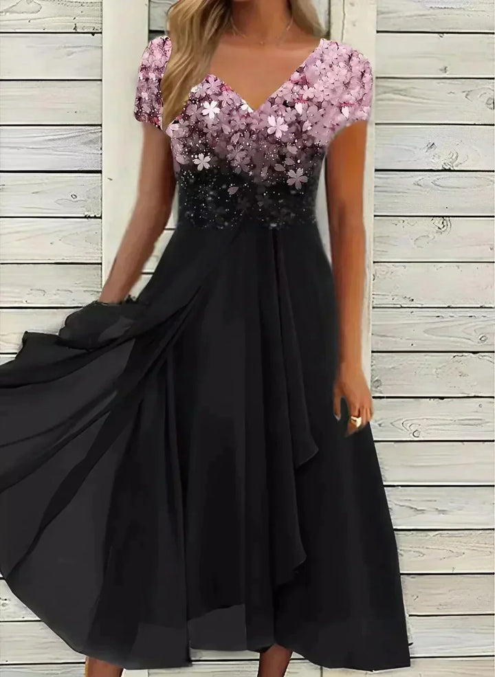 "Women's chiffon evening maxi dress with floral bodice, featuring flowing fabric and shimmering floral design for elegant eve