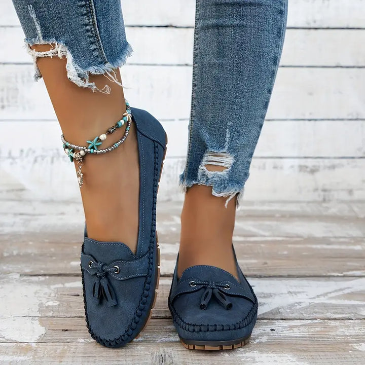 "Women's classic bow loafers in soft suede, stylish flat slip-ons with elegant bow accent, ideal for any occasion."