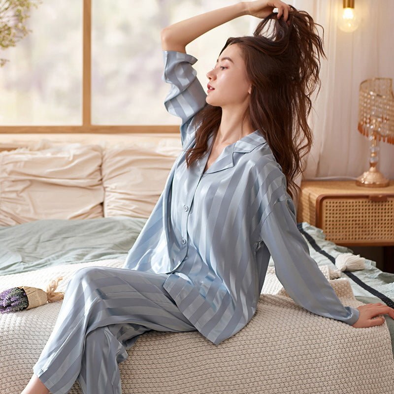 Women's classic striped pajama set with buttoned top and elastic waist pants in breathable fabric for comfort and style.