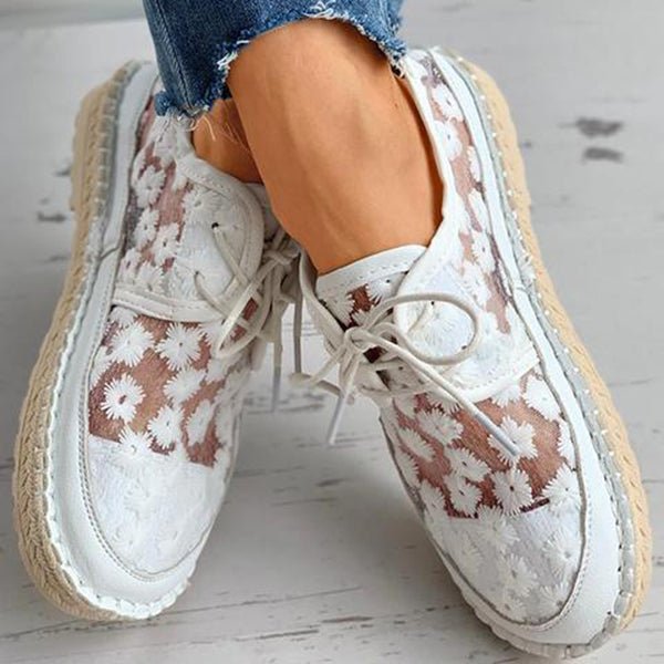 "Women's embroidered lace sneakers with floral mesh design, airy and elegant, featuring cushioned insoles for comfort."